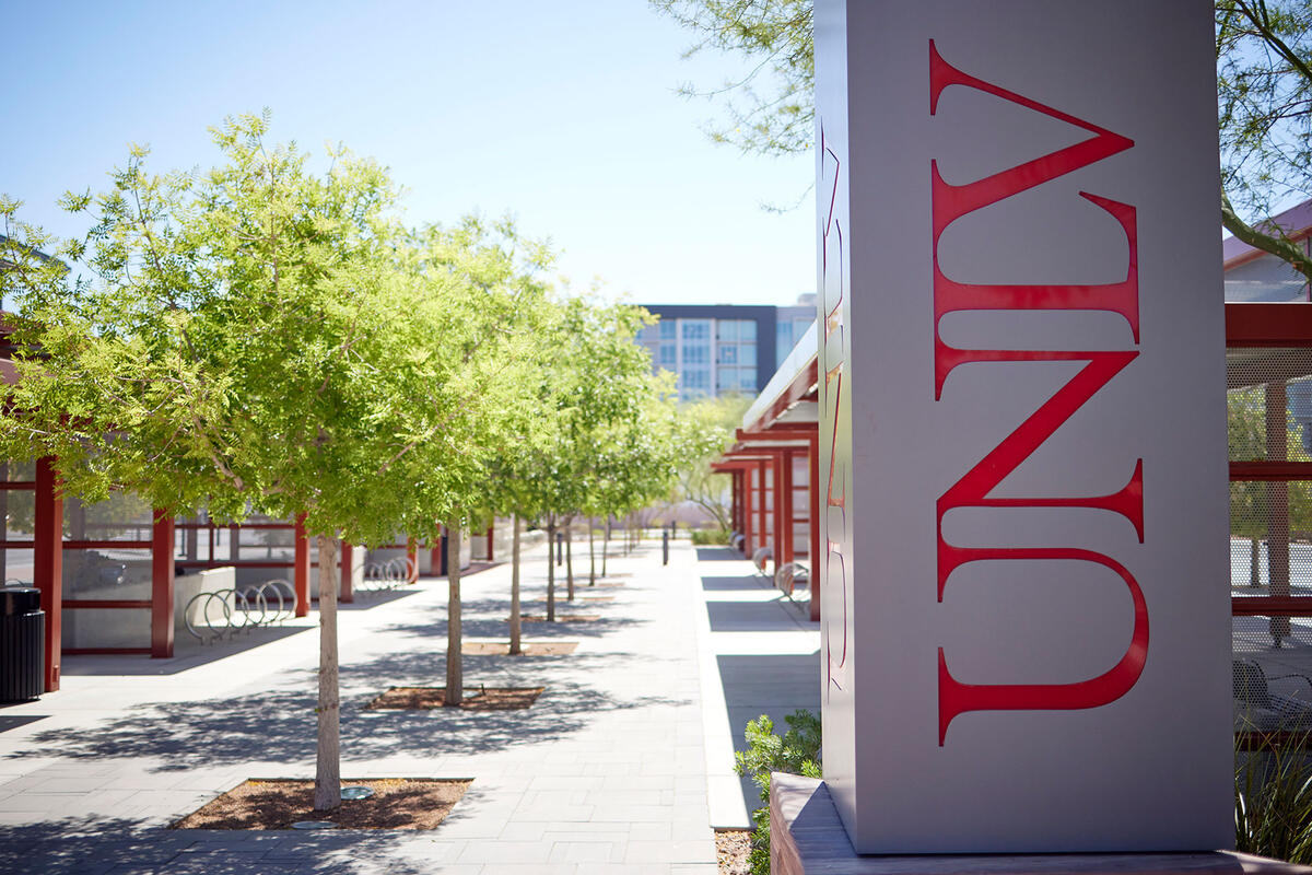 A transit center with a tall vertical structure that reads &quot;U-N-L-V&quot; in red letters